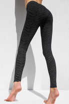 Black greenish zebra leggings high waist in cotton spandex shown from the side-back